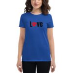 A blue t-shirt featuring the word "Love" with a heart symbol in red is worn by a female model in a neutral setting  displaying a casual and affectionate message.