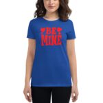 A blue t-shirt features the text "BE MINE" in large red letters with heart symbols surrounding it  worn by a person standing against a plain background.