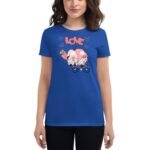 A person wears a blue t-shirt featuring a whimsical illustration of gnomes on a tricycle with the word "LOVE" above and hearts surrounding them  suggesting a playful and cheerful theme.