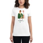 A woman is wearing a white t-shirt featuring a green cloaked figure with a staff and the word LUCKY adorned with small shamrocks below the illustration.
