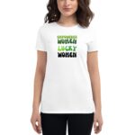 A woman stands wearing a white t-shirt featuring text that reads EMPOWERED WOMEN LUCKY WOMEN in green and black letters emphasizing female empowerment and positivity.