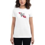 A woman is wearing a white t-shirt featuring the words love you in a playful font along with red hearts and a kiss mark  suggesting a romantic theme.