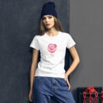 A model stands confidently against a textured gray backdrop wearing a white t-shirt featuring a pink rose design with the word love below it paired with blue jeans and a dark beanie
