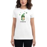 A woman wears a white t-shirt featuring a cartoon gnome with a green hat and clovers above it with the text St. Patrick's Day beneath the gnome.