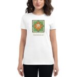 A woman wears a white t-shirt featuring a colorful graphic with a shamrock and the text HAPPY ST PATRICK'S DAY against a simple backdrop highlighting the festive design.