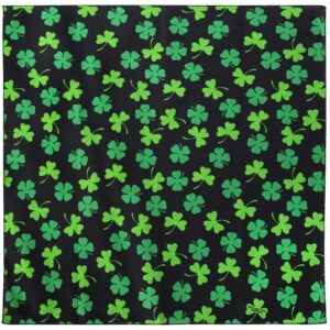 A black fabric square features numerous green shamrock patterns scattered evenly across the surface creating a vibrant and festive design that evokes themes of luck and celebration.