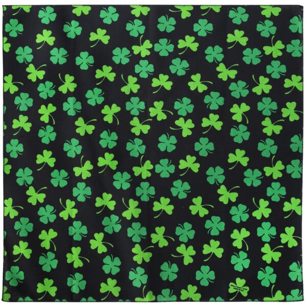 A black fabric square features numerous green shamrock patterns scattered evenly across the surface creating a vibrant and festive design that evokes themes of luck and celebration.