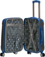 A blue suitcase is open with a gray interior displaying a polka dot pattern and organizational compartments wheels support mobility as it is prepared for packing in a travel context