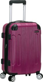 A vibrant pink suitcase with a textured surface stands upright on four wheels featuring a retractable handle and a zipper closure used for traveling or transporting belongings.