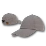 A gray baseball cap sits with its brim extended forward showcasing its fabric texture and adjustable strap at the back in a neutral background setting.