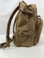 A tan backpack is displayed upright with adjustable straps and multiple compartments visible it appears sturdy and functional suitable for outdoor activities or travel