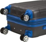 A black and blue suitcase features four wheels attached to the base and is stacked on top of another similar suitcase showcasing a textured surface designed for durability and mobility.