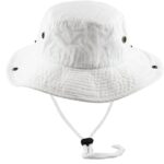 A white bucket hat sits upright displaying a wide brim and textured fabric with metal eyelets on the sides and an adjustable chin strap below the brim for secure wear.