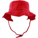 A red bucket hat sits upright featuring a wide brim and adjustable chin strap showcasing its textured fabric and metal ventilation eyelets designed for casual outdoor wear.