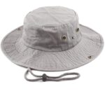 A gray bucket hat rests flat with a wide brim and ventilation grommets on the sides facing upwards while a drawstring is attached for adjustment and secure fit.