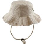 A beige bucket hat stands upright showcasing its wide floppy brim and ventilation holes it is often used for sun protection during outdoor activities in warm weather