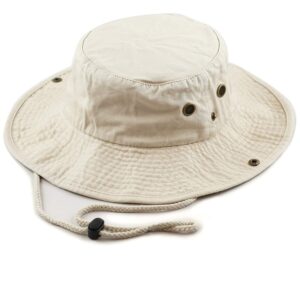 A beige bucket hat sits on a flat surface featuring a wide brim and ventilation eyelets with a drawstring for securing it during outdoor use.