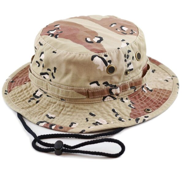 A camouflage bucket hat rests on a surface featuring a wide brim and adjustable chin strap showcasing a mix of tan and brown patterns ideal for outdoor activities.