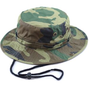 A camouflaged bucket hat rests on a flat surface showcasing its wide brim and structured crown designed for outdoor activities in natural settings.
