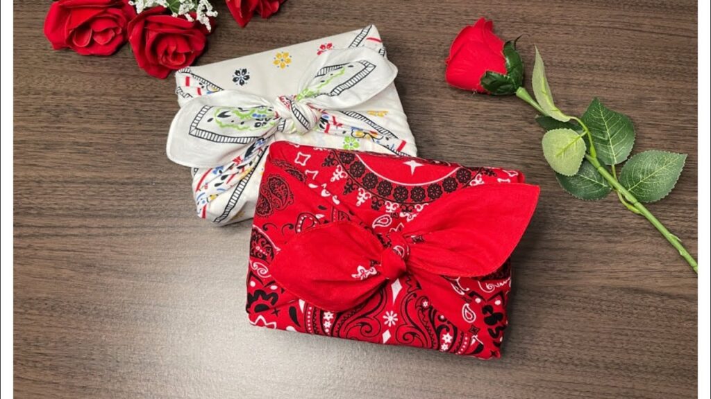 Two rectangular gifts wrapped in vibrant paisley bandanas, positioned casually but centered within the frame for a creative and eye-catching presentation.