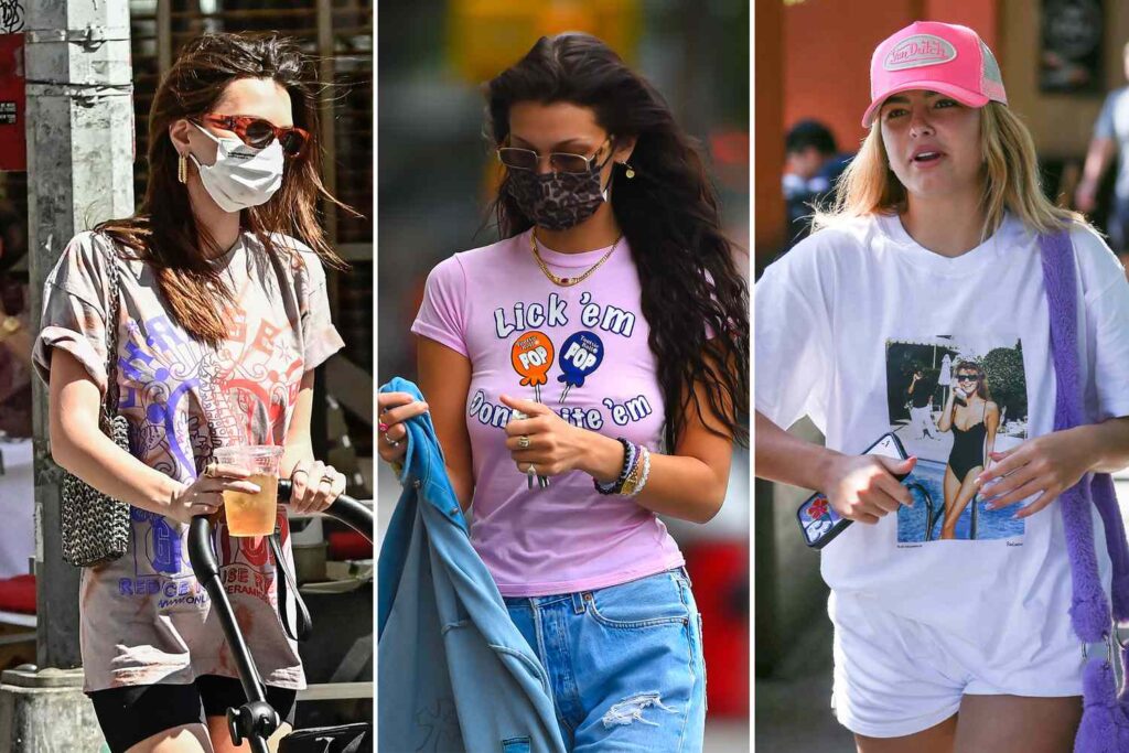 Three women in trendy casual outfits. Left: Printed tee, mask, sunglasses. Center: Pink "Lick 'em" tee, mask. Right: White graphic tee, pink cap, phone in hand. Energetic vibe.
