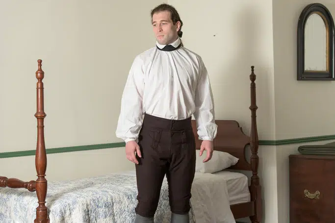 A man wearing renaissance white shirt