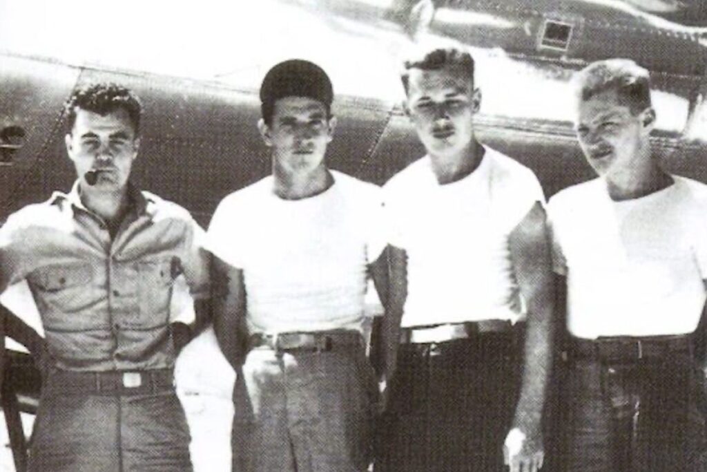 Four army men in white shirts from the World War One era.