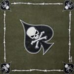 A patterned fabric features a large black spade with a skull and crossbones in the center surrounded by smaller spades and skulls against a green background framed by barbed wire.