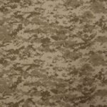 A textured fabric displays a digital camouflage pattern in varying shades of brown and tan creating a uniform surface designed for military or outdoor use.