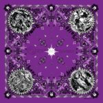 A purple bandana features intricate black designs with circular images in each corner depicting various figures surrounded by floral and cross motifs creating a symmetrical pattern.