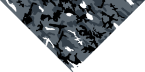 A patterned fabric features a diagonal design with varying shades of gray black and white resembling a camouflage motif spread across the surface creating a textured appearance.