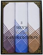 Three folded handkerchiefs displayed in a rectangular box with a decorative border. Each handkerchief features a distinct plaid pattern in shades of white  blue  and brown.
