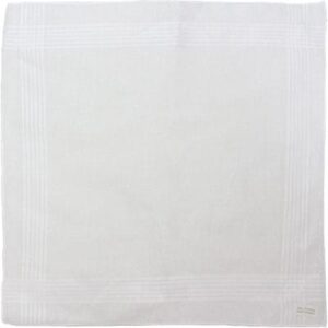 A square white tablecloth is laid flat showing a subtle textured pattern along the edges in a neutral setting which could be a dining table or display area