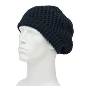 A black knitted beanie sits on a white mannequin head displaying its loose and textured design in a neutral setting focused on the hat's shape and style