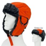 An orange fur-lined winter hat sits on a white mannequin head with the ear flaps secured up showing its soft lining and sturdy buttons against a simple white background. Sides Up