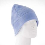 A light blue fleece beanie rests on a white mannequin head showcasing its pointed top and snug fit in a neutral  bright background.