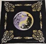 A black cloth features a central yin-yang symbol with a stylized tiger and dragon. Surrounding motifs include flames and serpent designs  adding a dynamic contrast to the deep background.