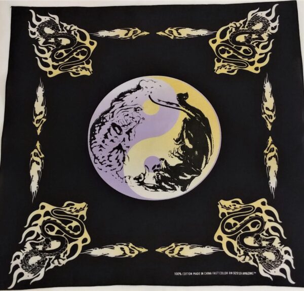 A black cloth features a central yin-yang symbol with a stylized tiger and dragon. Surrounding motifs include flames and serpent designs  adding a dynamic contrast to the deep background.