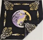 A black cloth features a central purple and yellow yin-yang design with intricate drawings of a tiger and a dragon surrounded by flame motifs in yellow and white.