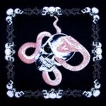 A black fabric features a graphic design of a skull entwined by a snake surrounded by a decorative border of skulls creating a dark and edgy aesthetic.