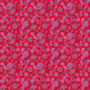 A vibrant red fabric features intricate patterns of paisleys  flowers  and decorative elements in blue  black  and pink  creating a festive and artistic visual texture throughout the design.