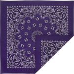 A square purple bandana features intricate white paisley patterns and floral designs while folded diagonally to showcase its vibrant color and decorative details.