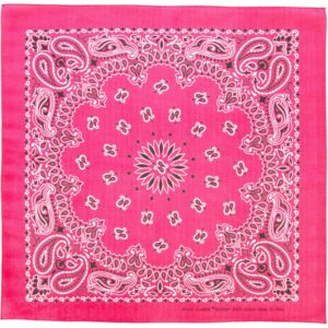 A pink bandana features intricate white paisley and floral patterns arranged in a symmetrical design with a central flower. It is made of cotton and is made in China.