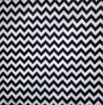 A black and white zigzag pattern fills the space creating a repetitive visual rhythm with sharp peaks and troughs against a solid background suggesting a modern design aesthetic.