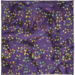 A vibrant purple fabric displays a pattern of multicolored butterflies and dots creating a lively and decorative texture. The fabric appears slightly wrinkled  enhancing its visual interest.