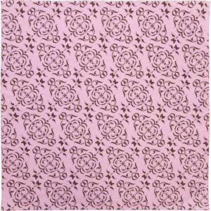 A fabric pattern features intricate brown floral and swirl designs on a soft pink background creating a decorative and elegant look suitable for various textile applications.