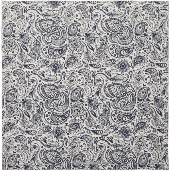 A patterned fabric featuring intricate paisley and floral designs in dark blue and white covers the surface  designed for decorative or textile use in a variety of contexts.