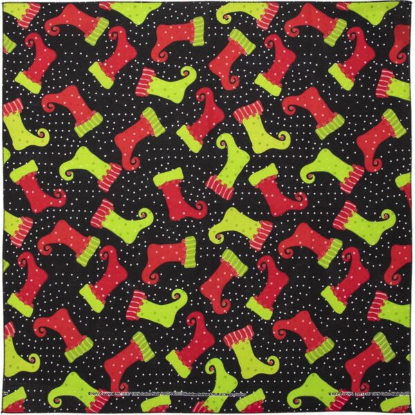 Colorful holiday stockings in red and green are playfully arranged on a black background with white polka dots creating a festive pattern ideal for seasonal decor.