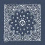 A square blue bandana features intricate white paisley and floral patterns radiating from a central star-like design creating a symmetrical and decorative appearance suitable for traditional or casual use.