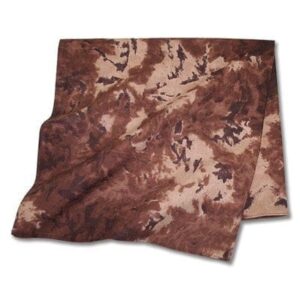 A piece of fabric with a brown  mottled pattern lies flat with some folds creating texture and depth in a neutral setting  suggesting it could be used for clothing or decoration.